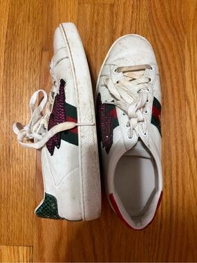 Gucci White Leather Sneakers with Green & Red Stripe and sequin lightning bolt.